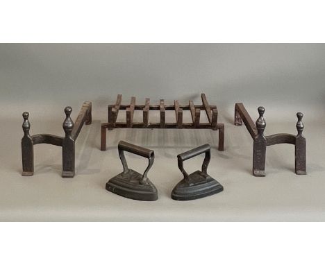 A wrought iron fire grate with a pair of fire dogs - the fire dogs 19.5cm high, 38cm long; together with two cast iron Victor