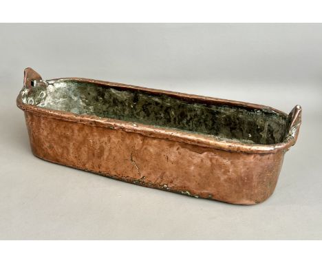 An antique copper planter - 19th century, of rounded rectangular form, with a rolled rim and twin handle mounts (the handles 