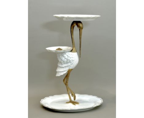 A modern Chinese porcelain and brass table centrepiece - in the form of a crane, with three graduated scalloped tiers in gilt