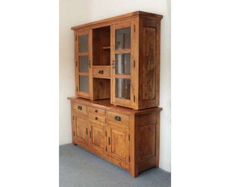 A mango wood part-glazed dresser - modern, with two cupboards with bevelled glass three-pane doors enclosing two adjustable s