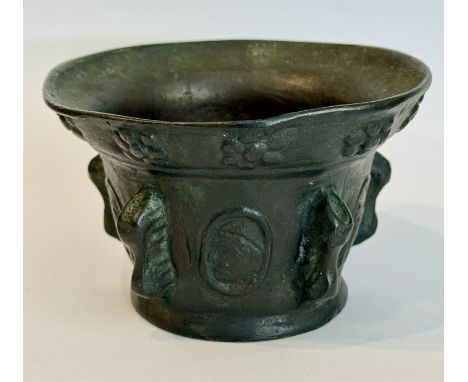 A French neo-classical bronze mortar - in the 18th century style, dark brown patination, cast decoration of classical bust me