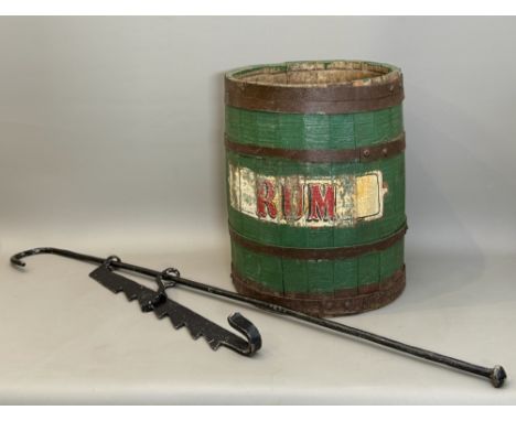 A stick stand converted from a coopered, painted barrel - with painted 'RUM' lettering, 44.25cm high; together with a wrought
