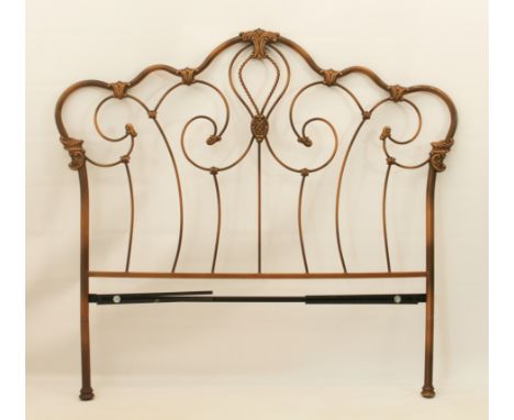 A Victorian-style antiqued gold painted double bedhead - with scrolled, foliate ornamented decoration, 153cm wide, 141cm high