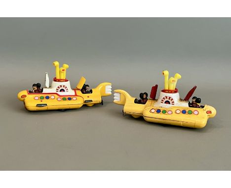 Two 1960s Corgi Toys 803 The Beatles Yellow Submarine - one example with yellow and white hatches (VG); the other with red ha
