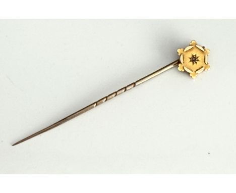 An Edwardian 15ct gold and diamond stick pin - 54mm long, in a morocco box.