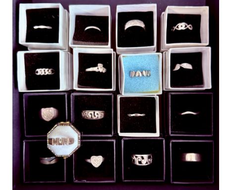 Seventeen sterling silver rings - all different, with pierced and solid bands, including a two-part brushed and polished wave