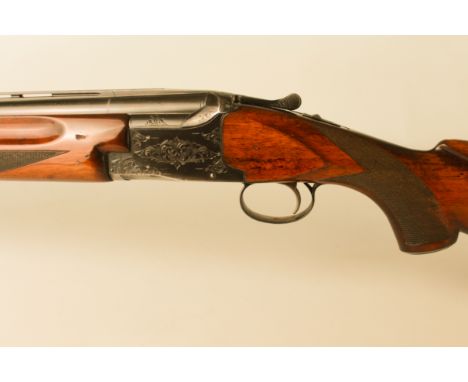 A Winchester Model 101 12-bore over-and-under shotgun - 14½ stock, 26" barrels with 2¾" chambers, (serial number 326804). Val
