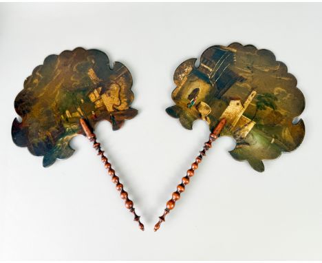 A pair of papier-m&acirc;ch&eacute; face-screens - &nbsp;painted with Italianate rural scenes, black lacquer backs, bobbin tu