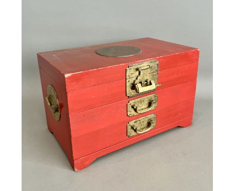 A Chinese red lacquered and gilt brass jewellery box - second half 20th century, with swing side handles, hinged lid enclosin