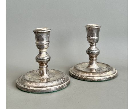 A pair of Elizabeth II silver dwarf candlesticks - Charles S Green &amp; Co, Birmingham 1985, of Queen Anne form, with urn no