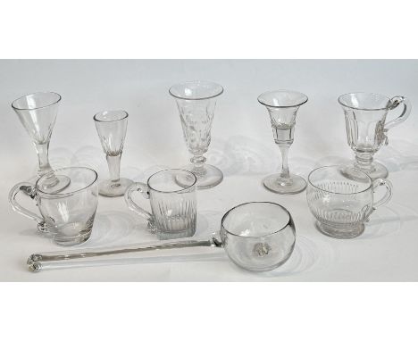 A 19th century blown glass punch ladle and four custard cups - the ladle with pontil to the cupped bowl and hooked terminal, 