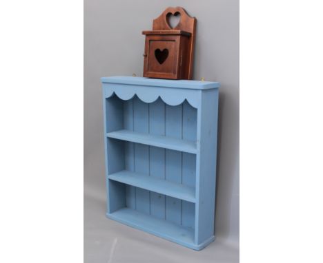 A small wall hanging painted pine bookcase - (LWH 52 x 13 x 64 cm) together with a wall hanging key cabinet with heart-pierce