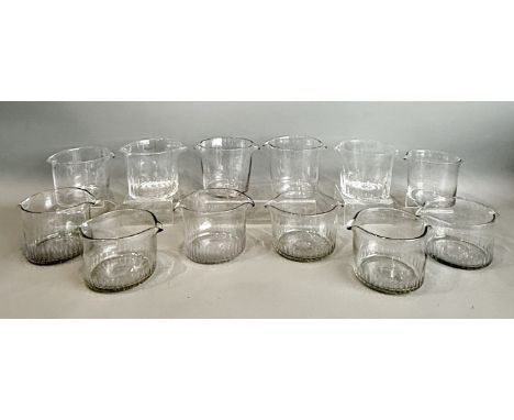 A collection of twelve Georgian wine glass rinsers - all of typical form with two opposing spouts, including three pairs (two