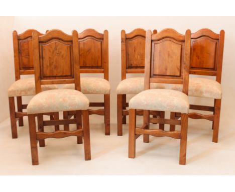 A matched set of eight panel and ladder back dining chairs - late 20th century, possibly in maple wood, the six panel back ch