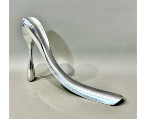 Manolo Blahnik: an aluminium shoe horn sculpture - impressed maker's mark to underside, in the form of a stylised, elongated 