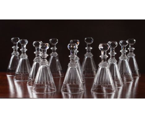 A good set of twelve cut glass stirrup cups - second half 19th century, the conical bowls with panel cut decoration, on hexag