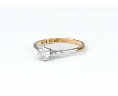 A platinum and 18ct gold solitaire diamond ring, approx. 0.33 ct, size N/O.