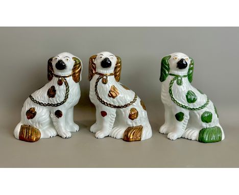 A pair of 19th century Staffordshire dogs - with separately moulded front legs, painted in copper lustre and white, 23.75cm h