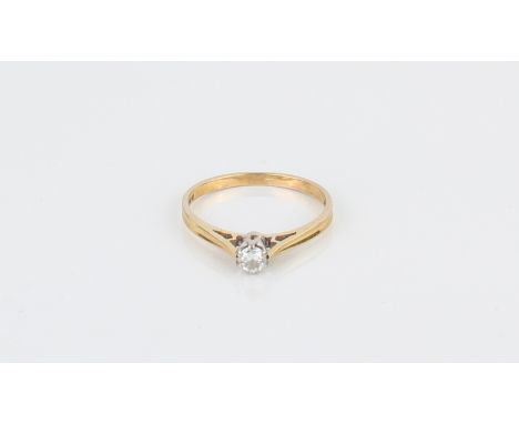An 18ct yellow gold and diamond solitaire ring - the approx. 0.1ct brilliant cut diamond in a six claw setting over chenier s