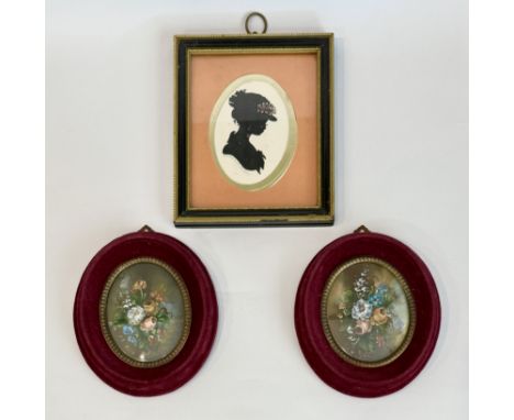A pair of miniature oil on card still life paintings - oval, signed, depicting bouquets of gardenflowers, in maroon velvet fr