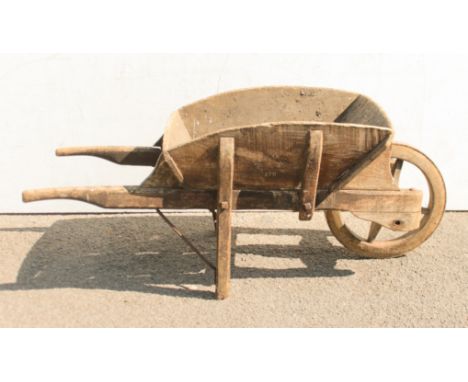 A late 19th century wheelbarrow - the wheel with iron tyre