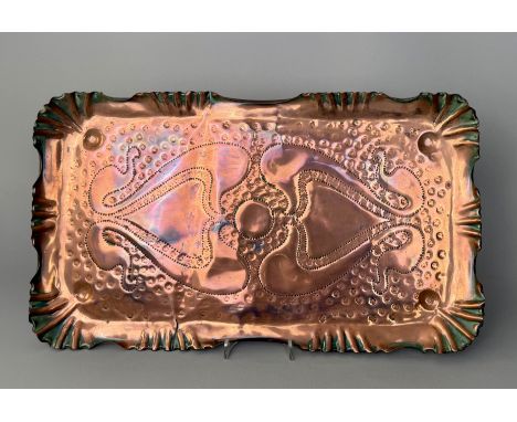 An Arts &amp; Crafts copper tray in the Cornish style - rectangular with shell-crimped edges and corners, with a pnuched styl