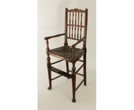 A charming 19th century ash and elm child's spindle-back high chair - the back with shaped top rail centred with a shell, ove