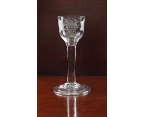 A mid-18th century engraved wine glass - circa 1745, the ogee bowl engraved with a fruiting vine and a bird, on a plain stem 
