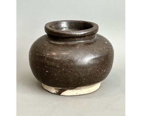 A Chinese brown glazed earthenware jar - possibly late-Song / early Ming period, of bun form with a short, upright neck with 