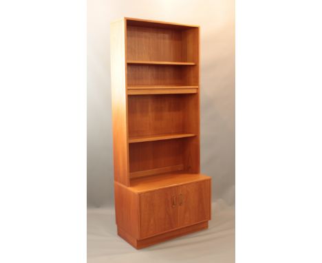 A vintage 1970s G-Plan teak cupboard-bookcase  - three shelves over a two-door cupboard. (LWH 81 x 46 x 188.5cm)   
