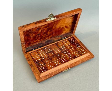 A cased set of burr yew wood and&nbsp; mother of pearl dominoes - late 20th century, in a fitted burr yew case, 16 x 10cm.