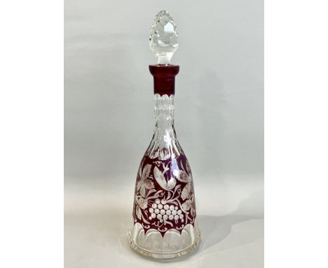 A Bohemian ruby cased and engraved glass decanter - the body engraved with fruiting vines between bands of panel and hexagona