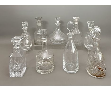 Nine various cut glass and crystal decanters - including a pair of French decanters made for 'Hine Cognac', etched marks, 23.