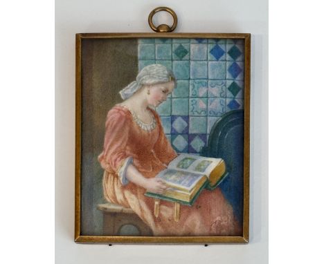 A French School miniature on ivory, second half 19th century - watercolour, depicting a woman reading in an interior beside a