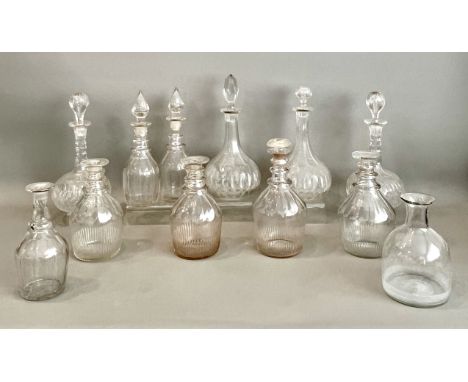 Twelve 19th and early 20th century cut glass decanters - including a closely matched set of four Georgian Prussian decanters 
