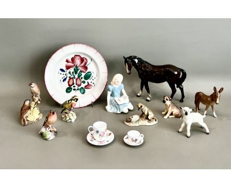 A small collection of bone china figures by Beswick, Royal Worcester and Royal Doulton - comprising a Beswick dark brown mare