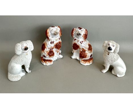 Four 19th century Staffordshire dogs and poodles - comprising a matched pair of white glazed poodles with shredded clay fur a