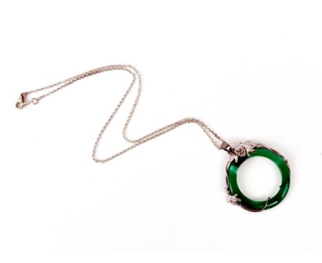 A silver and jade-style green stone necklace.