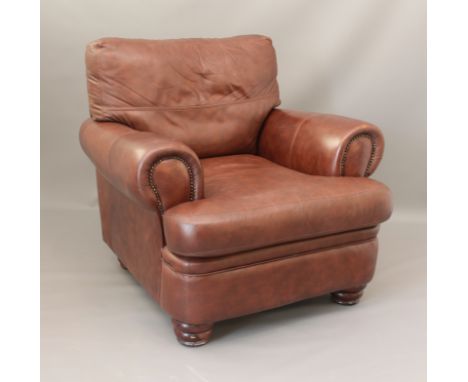 A brown leather and faux-leather armchair, 97cm wide, 90cm high.