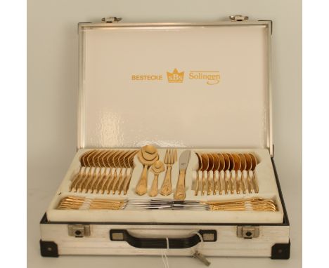 A 12- place canteen of gold-plated cutlery by Bestecke (Solingen) - appears to be unused