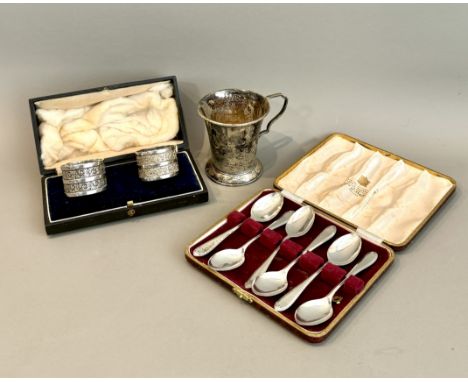 Three silver items, comprising -  1. A George V christening mug, Aaron Lufkin Dennison, Birmingham 1935, weight 74g 2. A case