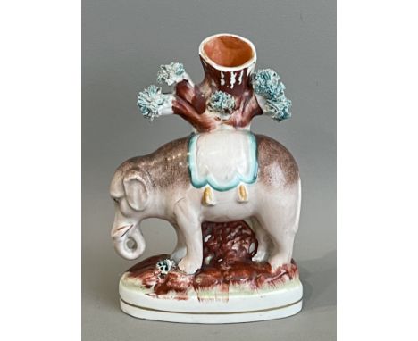 A 19th century Staffordshire elephant spill vase - 14.4cm high (restoration to rim of vase).