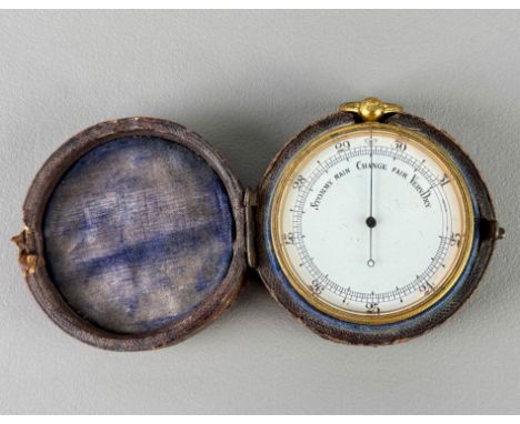 A brass-cased pocket barometer with white enamel dial in original case.