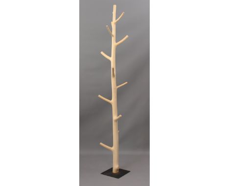 A branch-form hat and coat stand - the bark-stripped trunk supported by a square steel baseplate, 191cm high.