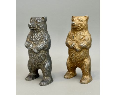Two cast alloy standing bear money banks - mid-20th century, one painted gold, the other bare metal, 15.25cm high.
