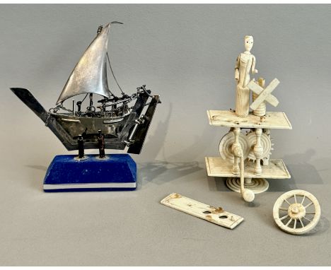 An Italian sterling silver model of a sailing boat - stamped 'Italy 925', with moving rudder, anchor on chain and separate bl