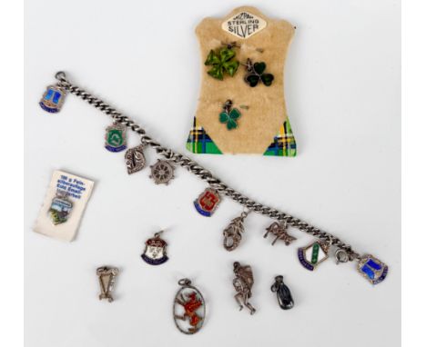 A vintage silver charm bracelet with a small collection of silver and white metal charms