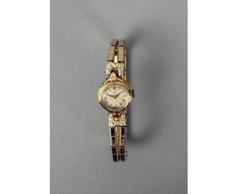 A lady's vintage 14ct gold Tudor bracelet watch - the 19mm case hallmarked '14K 0.585', no. 729101, the circular silvered dia