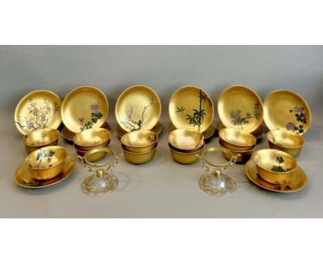 A set of twelve Japanese gilt lacquer bowls and stands - early 20th century, both the bowls and stands finely painted with va