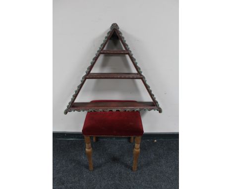 A blonde oak dressing table stool and a painted triangular wall shelf 